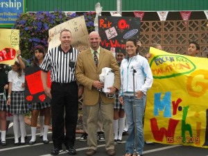 Dane Whipple is cheered on by his fourth grade students